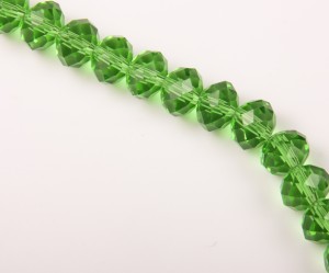 Cristale fatet.  verde transp 6X8 mm, gaura 1.5 mm, 70buc