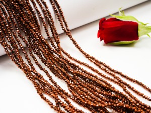 Cristale fatetate din sticla 2X1.5 mm, bronz inchis metalizat cca 220 buc, gaura 0.6 mm